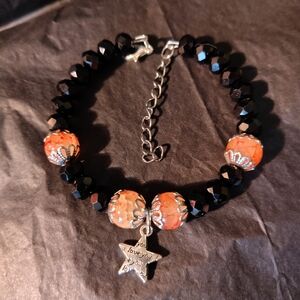 Handmade Black and Orange Glass Beaded Bracelet with Star Charm